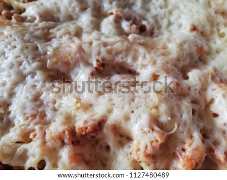 Close up picture of cannelloni served on a dish.