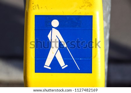 Symbol for disabled person at the traffic light . button for blind people