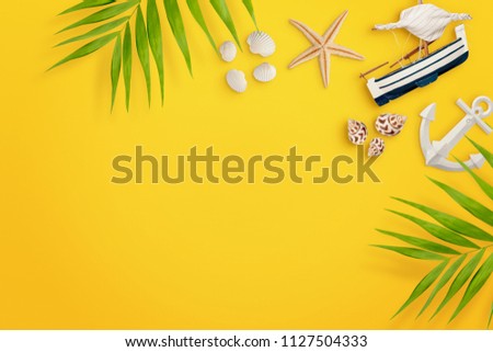 Palm leaves, seashells, boat, starfish, anchor on yellow background. Empty space. Travel concept. Summer holiday background. Flat lay
