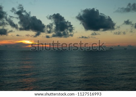 Wonderful sunset on the high seas on the oil rigs 