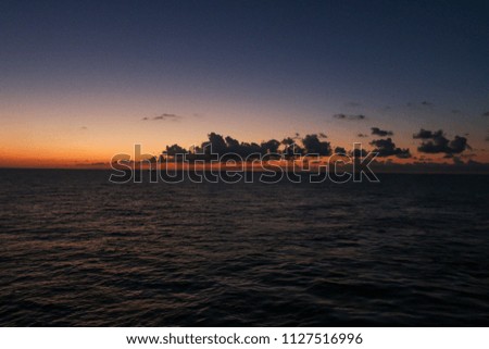 Wonderful sunset on the high seas on the oil rigs 