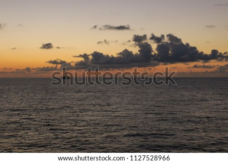 Sunrise over the oil towers and offshore oil rigs