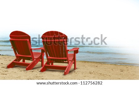 Retirement Aspirations and financial planning symbol with two empty blue adirondack chairs on a tropical sandy beach with ocean view as a business concept of future successful investment strategy. Royalty-Free Stock Photo #112756282