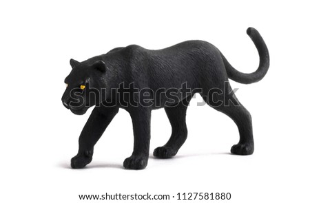 Miniature model of a black panther isolated on a white background