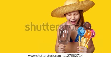 Emotion expression face child closeup. Girl eats ice cream. Concept summer, season vacation, travel, sale. Yellow blank background for advertising, shop, showcase, banner, design copy space, web site.