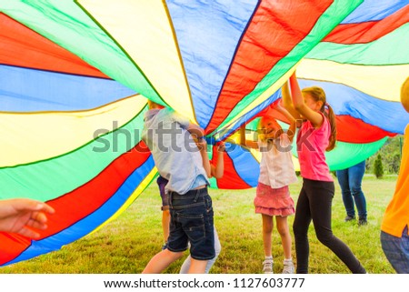 Large colorful cloth covered group of friends
