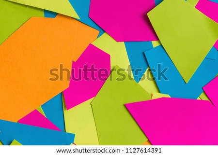 Colorful bright paper texture. Geometrical composition. background of colored paper. Pink, green, blue, yellow. Flat lay