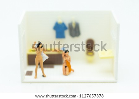 Miniature people : personal wearing a dress in the toilet, daily routine, personal errands in the bathroom.
