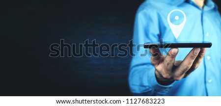 Man holding phone with GPS icon. Concept of mobile navigation