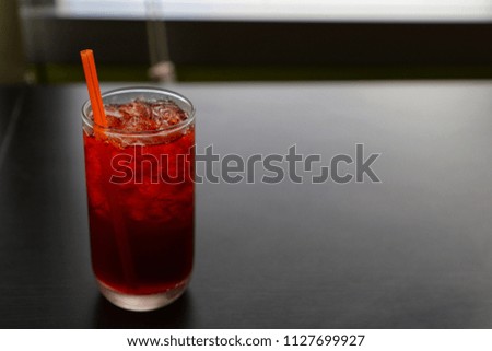 Black tea in a glass placed on the table.