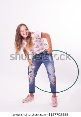 girl with hula hoops on a white background
