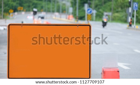 An orange warning on the road.