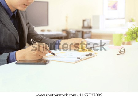 Businessman working with financial document paper on workplace home office.