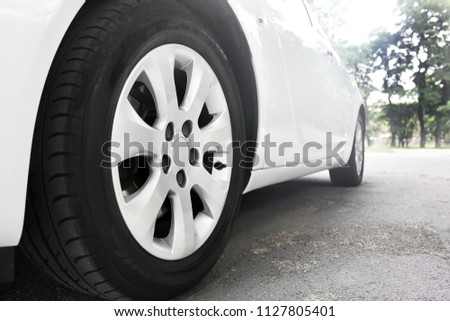 Car wheels close up on a background of asphalt. Car tires