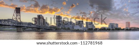 Sunset Over Portland Oregon City Skyline Along Willamette River Waterfront Panorama