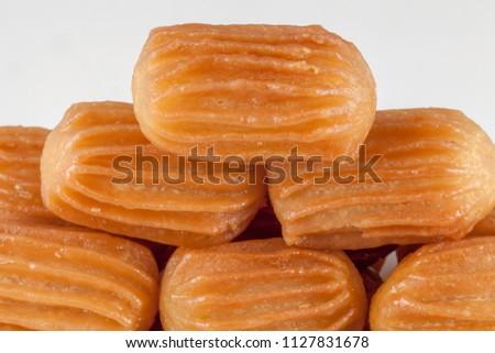 balah al sham ( Arabian sweet contains Potato paste mixed with water and fried in deep oil , then covered with honey) Royalty-Free Stock Photo #1127831678
