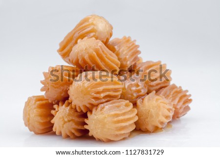balah al sham ( Arabian sweet contains Potato paste mixed with water and fried in deep oil , then covered with honey) Royalty-Free Stock Photo #1127831729