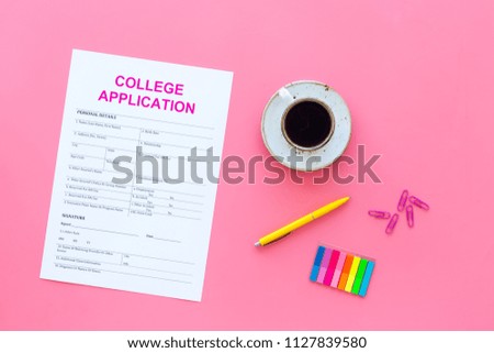 Higher education. College application form ready to fill near coffee cup and stationery on pink background top view