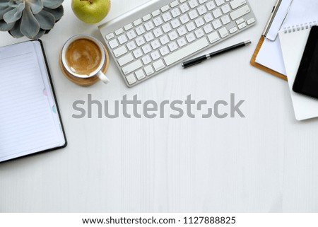 Business table top with mock up office supplies on white wooden desk.