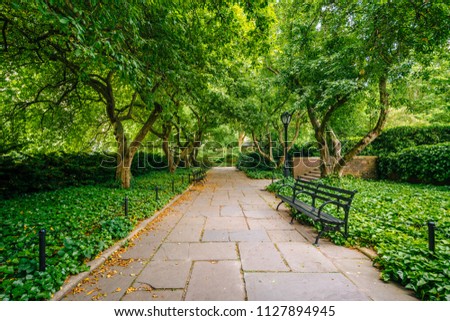 Tree-lined walkway at the Conservatory Garden, in Central Park, Manhattan, New York City.