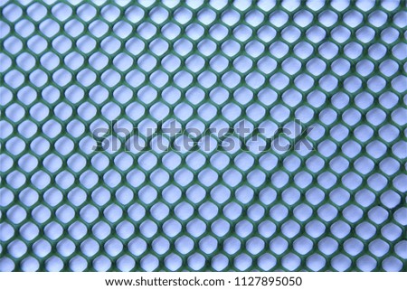 Texture of green plastic mesh with high contrast effect for design business background,for wallpaper,design concept