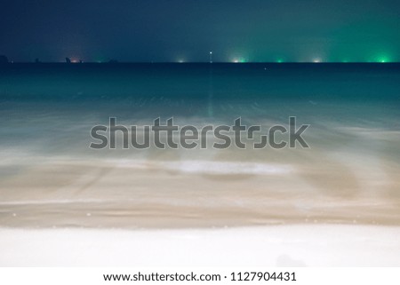 Seascape night background blurred motion,defocused sea.