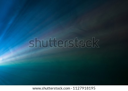 colorful beautiful spotlight . wide lens projector with light beam for movie and cinema at night . close up texture abstract smoke background . screening for multimedia .