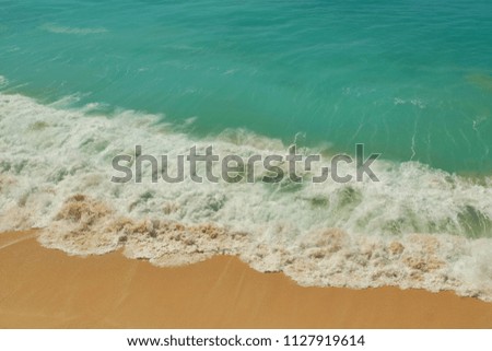 Beautiful tropical beach and ocean wave on seashore. Summer vacation travel holiday background concept.