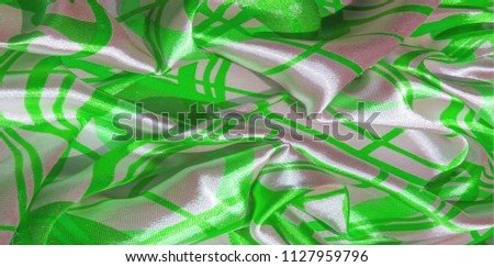 Silk. The fabric is green in steel, the fabric is colored with green lines. Fix it with this exciting patchwork ! This material is slightly transparent, pleasantly soft and contains an elegant drapery