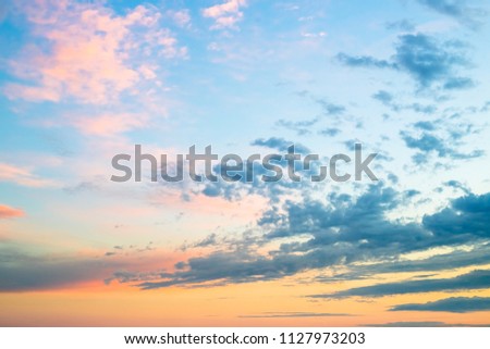 Beautiful colors sunset clouds sky background.Evening colorful clouds,sunlight with dramatic sky on blue background.Natural photo landscape for website and page.