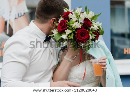 groom with the bride, the bride's bouquet