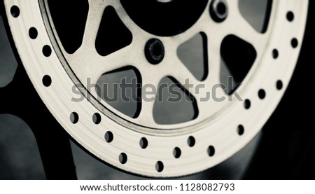 Stylish disc brake plate of a motorbike isolated metallic object unique photo