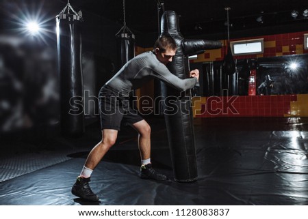 The athlete makes the throw of the dummy, the training of the wrestler