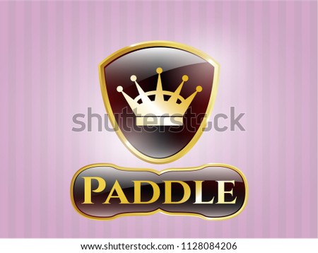  Gold emblem or badge with queen crown icon and Paddle text inside