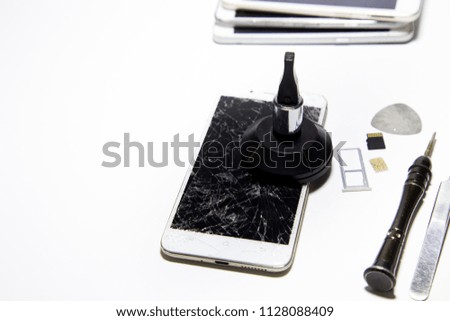 Repair smartphone. Male solder parts smartphone. Close-up.