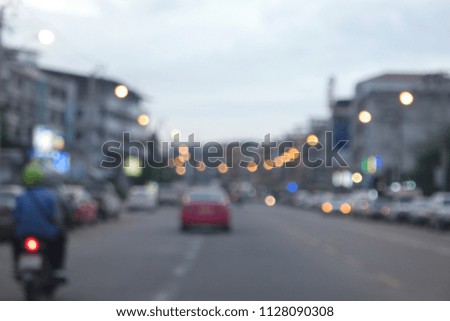 Defocused image, street lights at evening, colorful bokeh, abstract background.