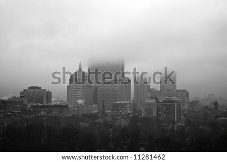 view of boston buildings obscured by clouds on a rainy morning in spring
