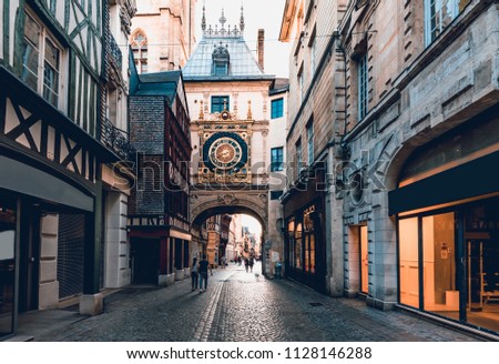 Street with the Gros-Horloge (Great-Clock) is a fourteenth-century astronomical clock and timber framing houses in Rouen, Normandy, France Royalty-Free Stock Photo #1128146288
