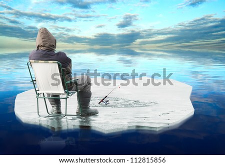 Picture of a fisherman catching a fish on ice.