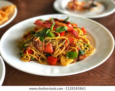 Spicy spaghetti with bacon, chilli  and basil, this picture is taken with close up view