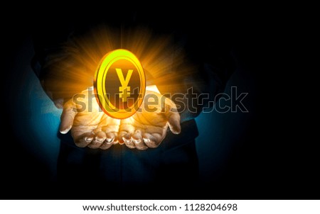 Gold coin in hand businessman,Global Currency,Financial Markets and Global Economy Concept