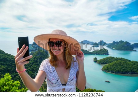 Female Traveler Taking Selfie with Tropical Islands at Angthong National Marine Park in Thailand