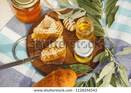 honey honeycomb on wooden plate