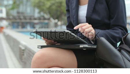 Close up of businesswoman touch on tablet computer