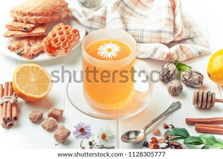 Tea in a cup on a white background with flowers