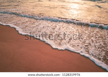 Sunset beach and smooth wave abstract texture background. Copy space of summer vacation and business travel relax concept. Vintage tone filter effect color style.
