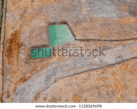 Aerial view of a rain water pond on the construction site.
