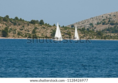 White yachts sailing on the Adriatic in the Kornati National Park in Croatia