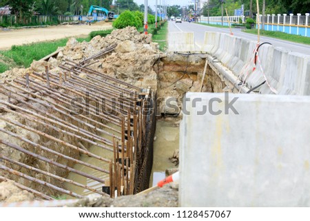 Construction of concrete roads to increase strength to support the construction of bridges.