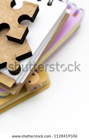 Jigsaw puzzle piece on the stack of books, image use for solving problems, education background concept.